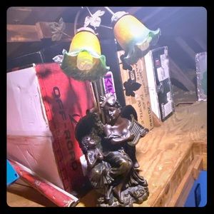 A pair of old antique one of a kind angel lamps